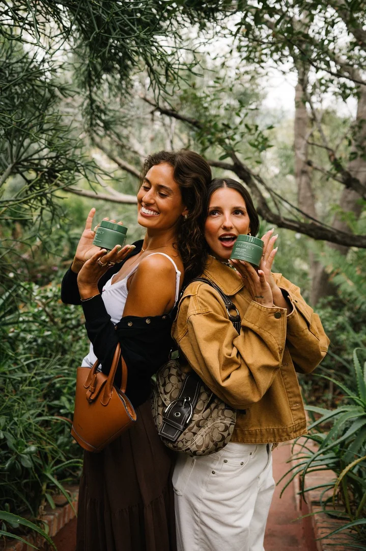 Guests in the garden at Flamingo Estate — Farmacy Beauty