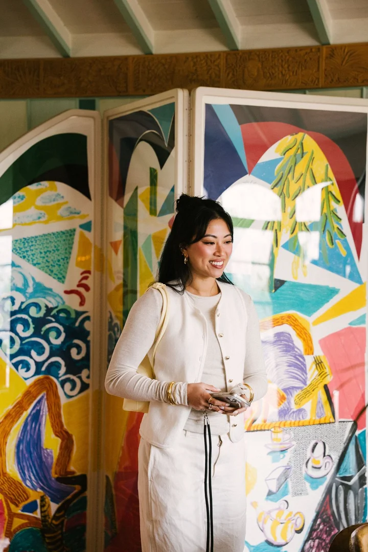Portrait against the mural at Flamingo Estate — Farmacy Beauty