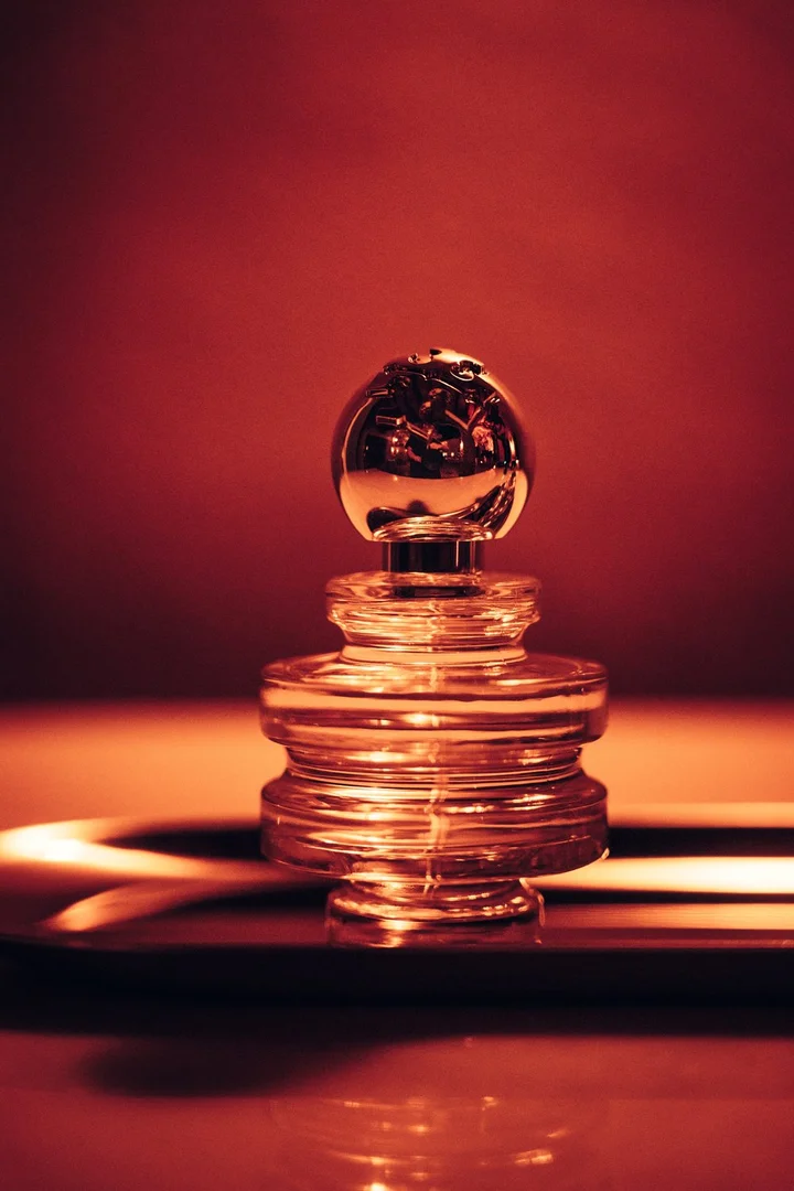 Tory Burch Sublime fragrance bottle in amber light